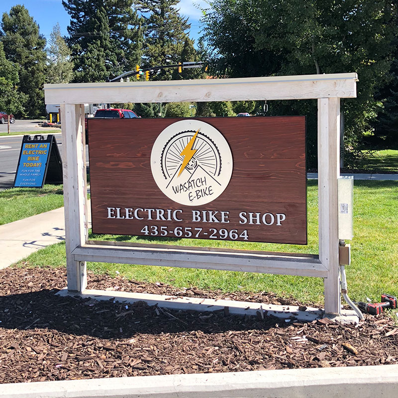 Electric Bike Shop large wood sign outside