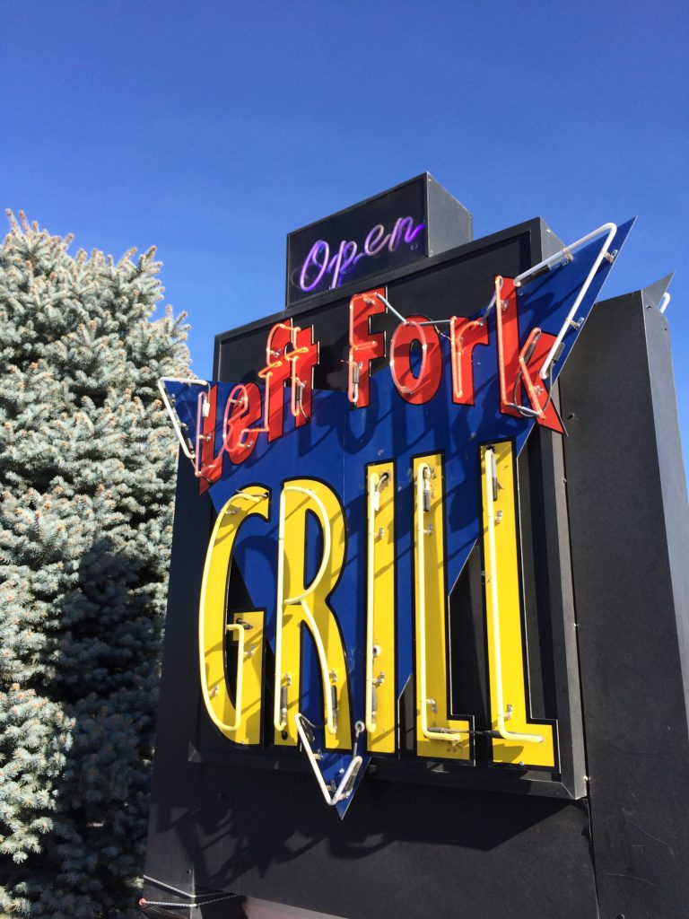 Neon Left Fork Grill sign.