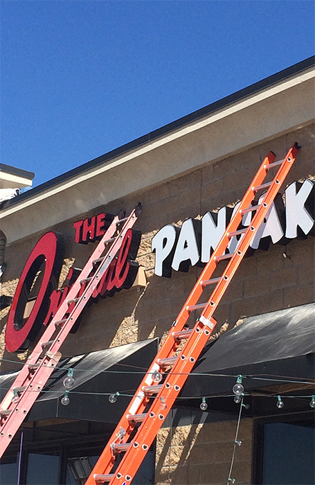Installation of The Original Pancake sign